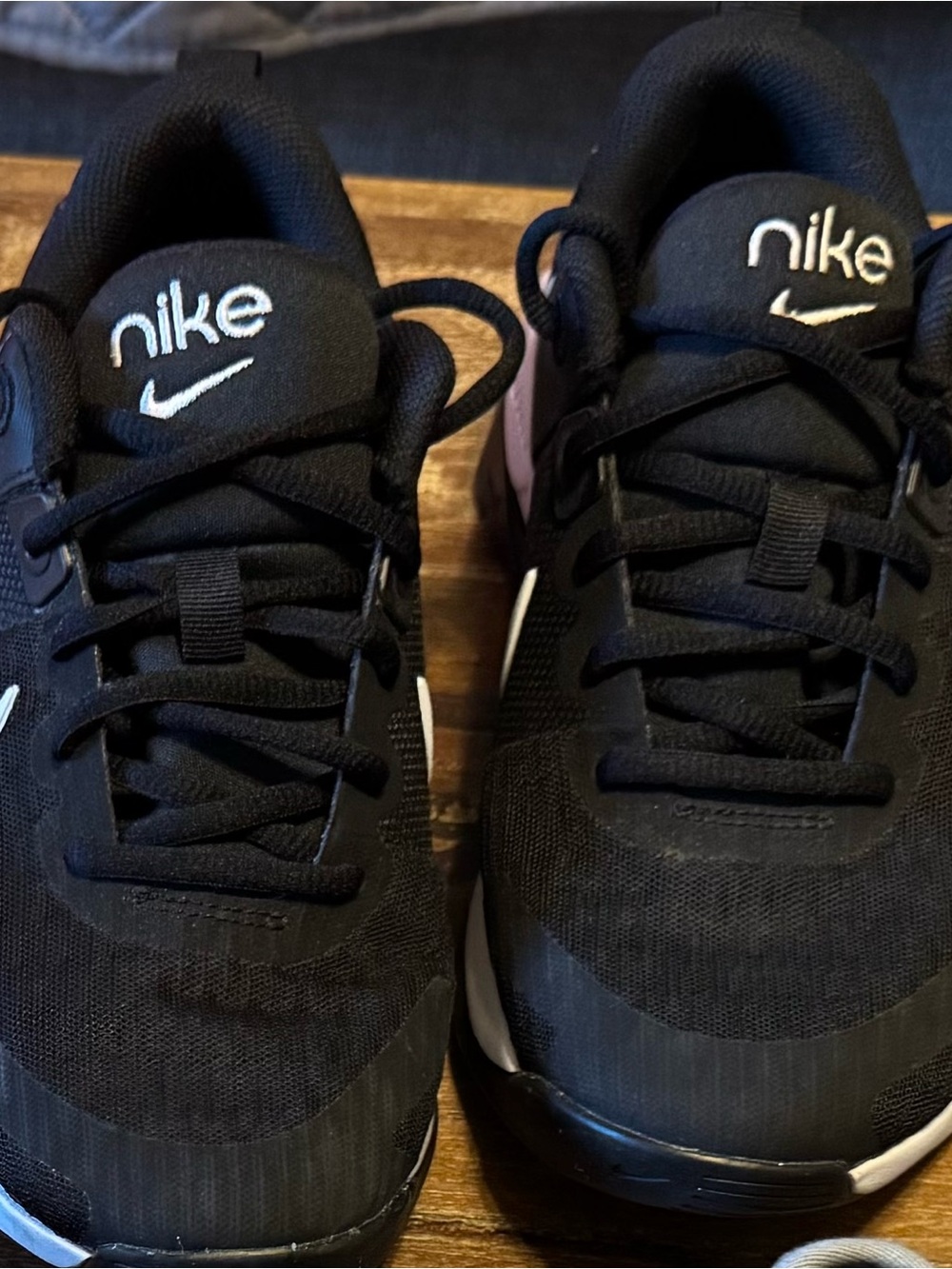 Nike women’s Black Sneakers with White Swoosh